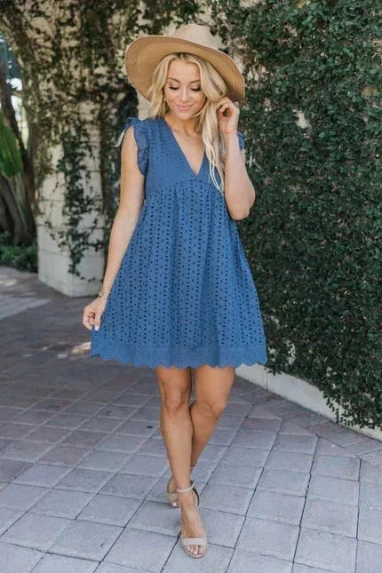 Deep Blue - White eyelet mini dress featuring a V-neckline, ruffle flutter sleeves, and a scalloped hem.