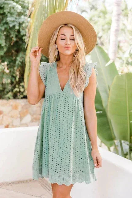 Pale Green - White eyelet mini dress featuring a V-neckline, ruffle flutter sleeves, and a scalloped hem.