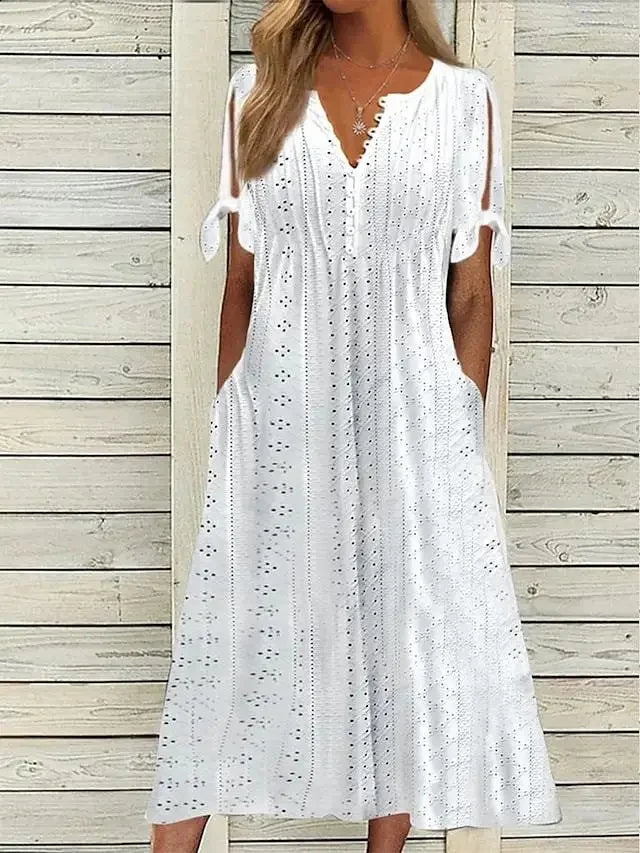 WHITE - A woman wearing a light blue midi-length eyelet dress with a scalloped V-neckline, split tie-sleeves, and side pockets, shown alongside color variations in pink, white, and mint green.