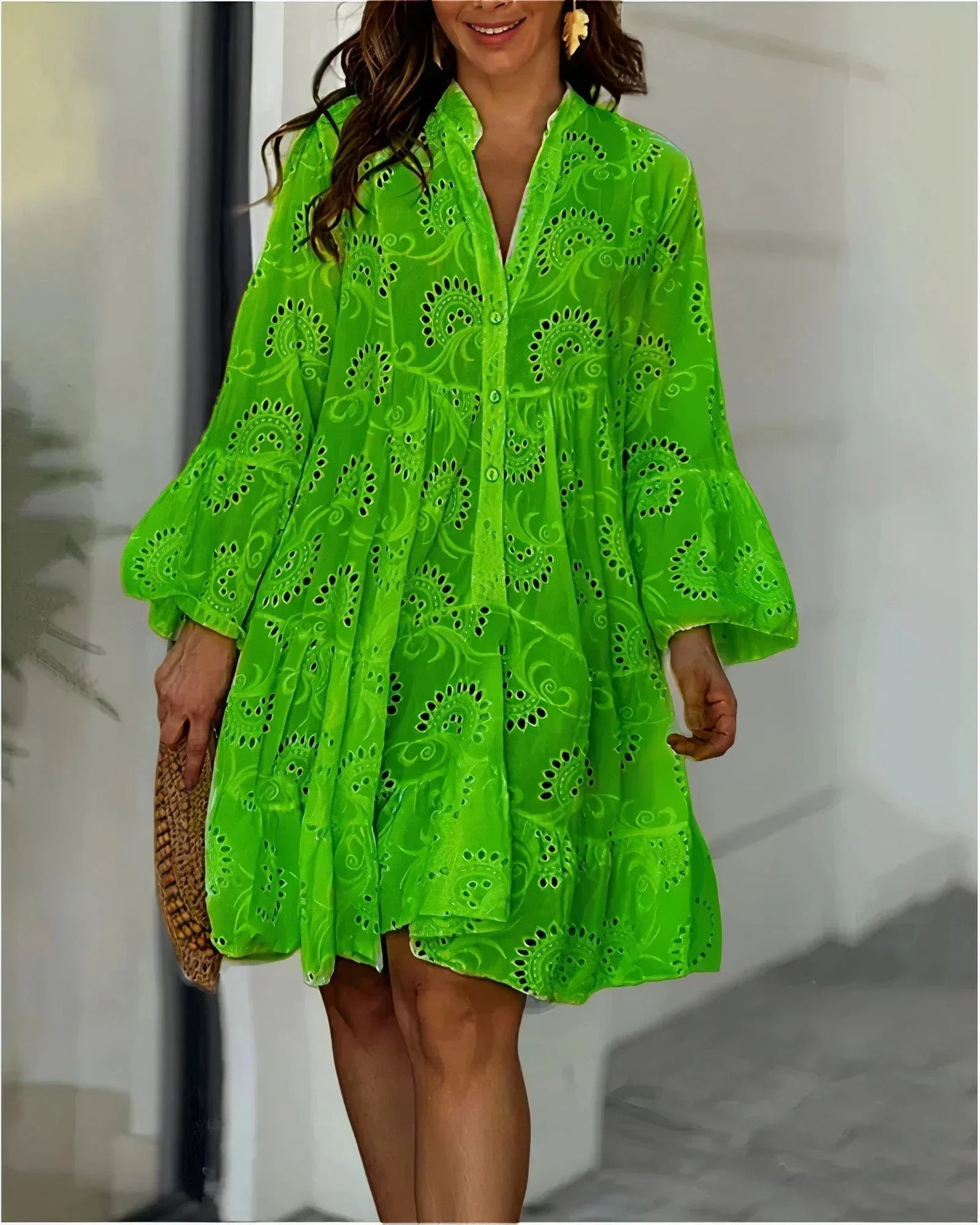 Green - Bright pink eyelet mini dress featuring a collared button-front, voluminous bell sleeves, and a flowing tiered skirt.