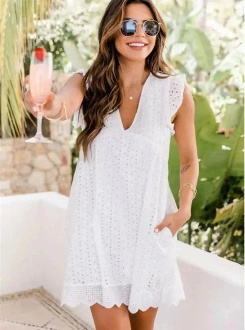 White - Black eyelet V-neck mini dress with flutter sleeves and a scalloped hem.