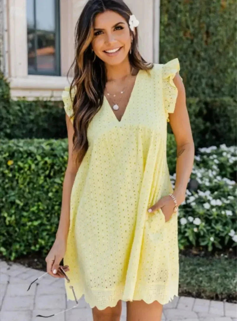 Yellow - Black eyelet V-neck mini dress with flutter sleeves and a scalloped hem.