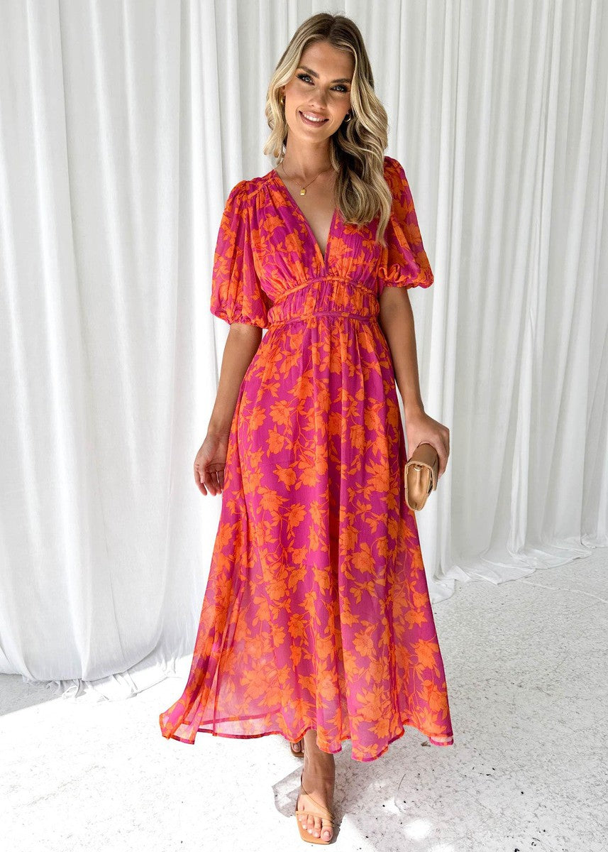 Orange - Bright pink and orange floral chiffon midi dress featuring a deep V-neckline, short puff sleeves, and a gathered waist, styled with a flowing skirt.