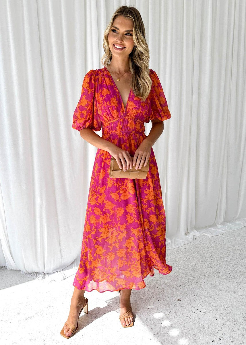 Orange - Bright pink and orange floral chiffon midi dress featuring a deep V-neckline, short puff sleeves, and a gathered waist, styled with a flowing skirt.