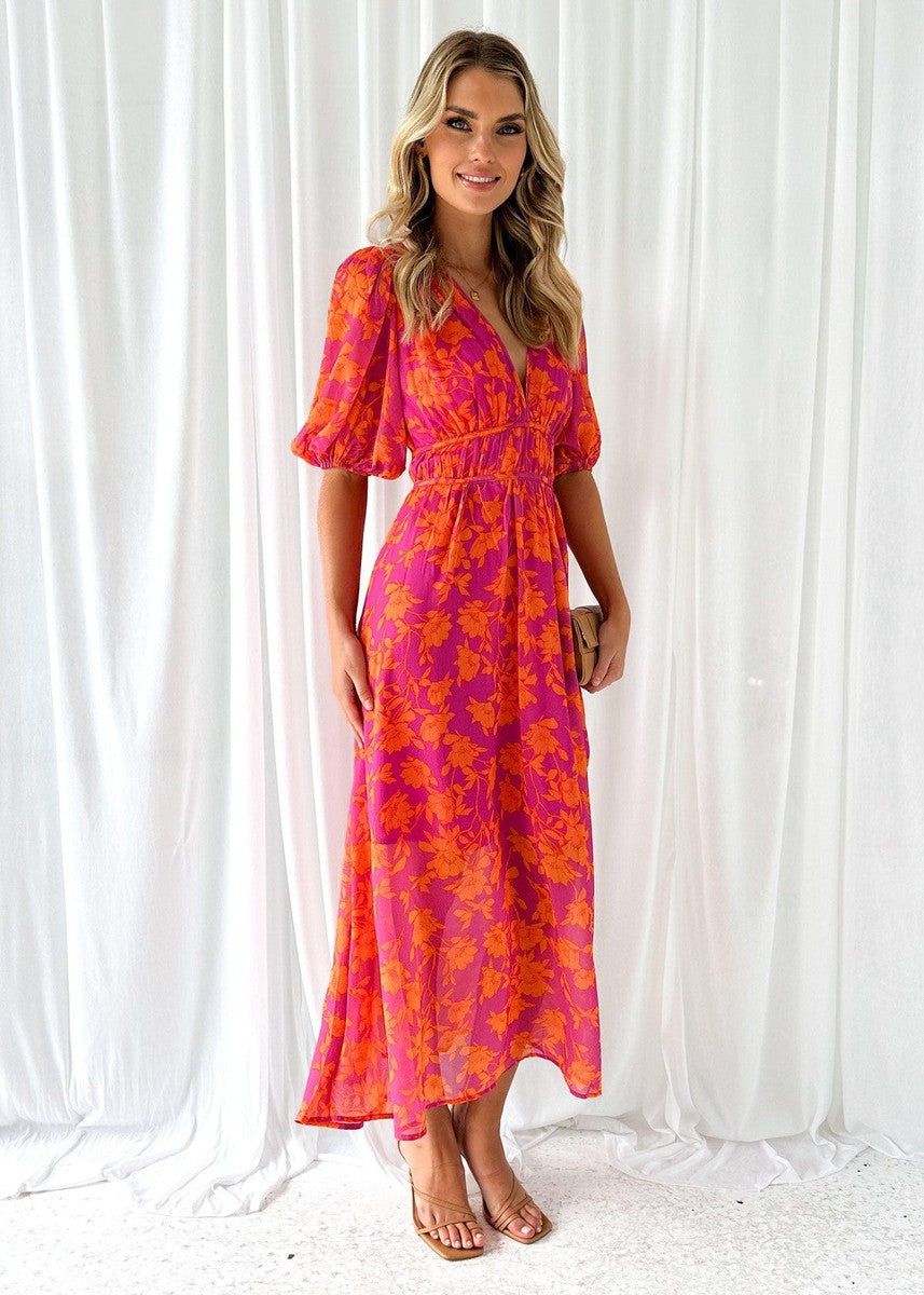 Orange - Bright pink and orange floral chiffon midi dress featuring a deep V-neckline, short puff sleeves, and a gathered waist, styled with a flowing skirt.