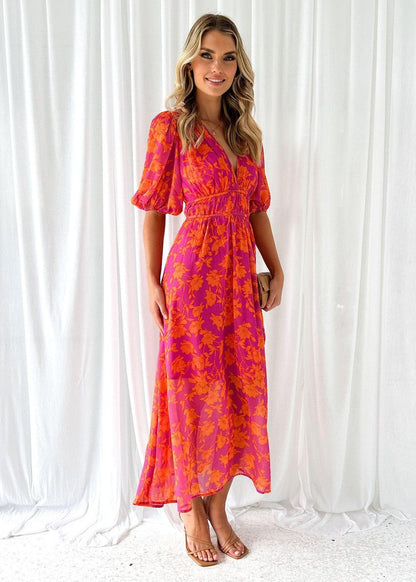 Orange - Bright pink and orange floral chiffon midi dress featuring a deep V-neckline, short puff sleeves, and a gathered waist, styled with a flowing skirt.