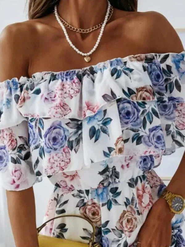 Blue - Black floral chiffon mini dress featuring an off-the-shoulder ruffled neckline and a tiered skirt.