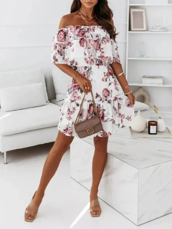 Pink - Black floral chiffon mini dress featuring an off-the-shoulder ruffled neckline and a tiered skirt.