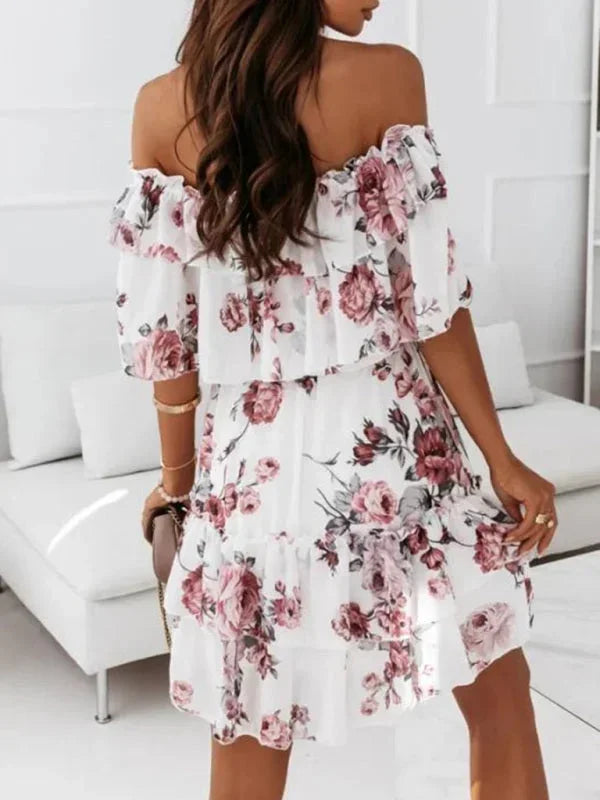 Pink - Black floral chiffon mini dress featuring an off-the-shoulder ruffled neckline and a tiered skirt.