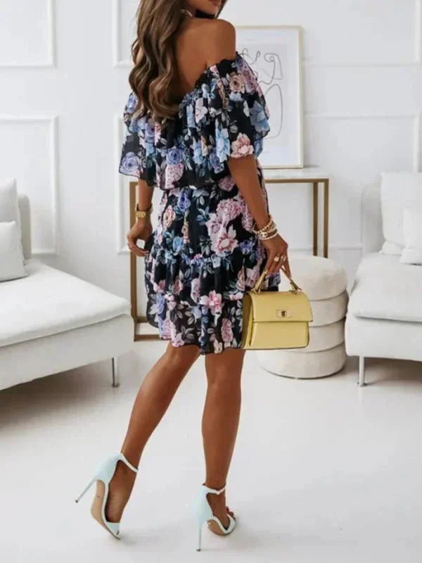 Black - Black floral chiffon mini dress featuring an off-the-shoulder ruffled neckline and a tiered skirt.