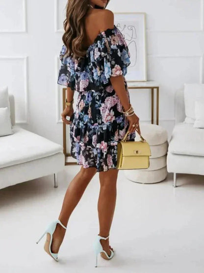 Black - Black floral chiffon mini dress featuring an off-the-shoulder ruffled neckline and a tiered skirt.