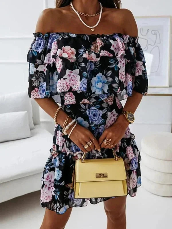 Black - Black floral chiffon mini dress featuring an off-the-shoulder ruffled neckline and a tiered skirt.
