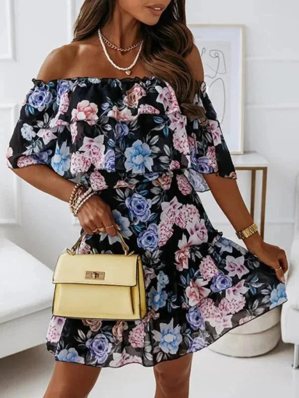 Black - Black floral chiffon mini dress featuring an off-the-shoulder ruffled neckline and a tiered skirt.