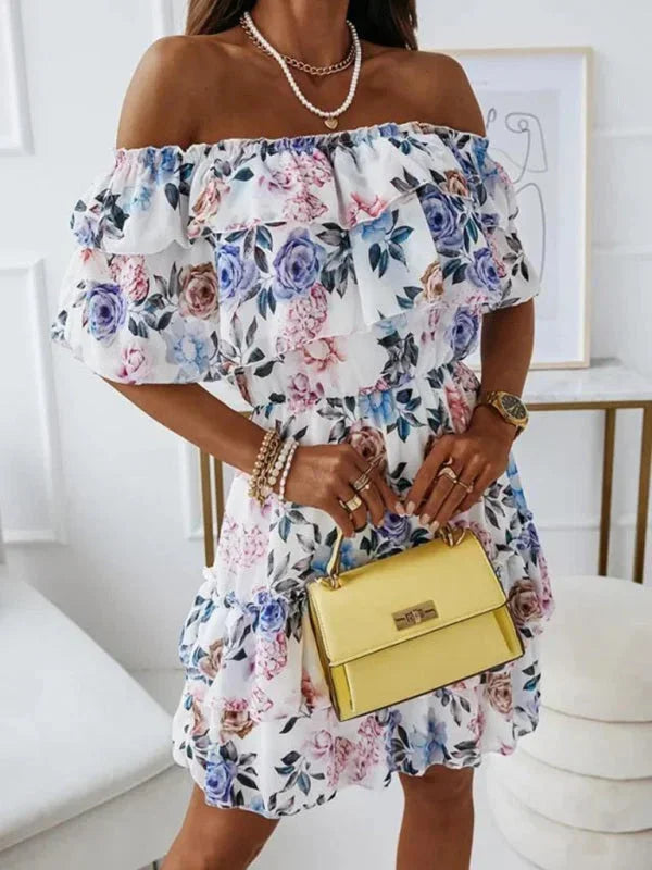 Blue - Black floral chiffon mini dress featuring an off-the-shoulder ruffled neckline and a tiered skirt.