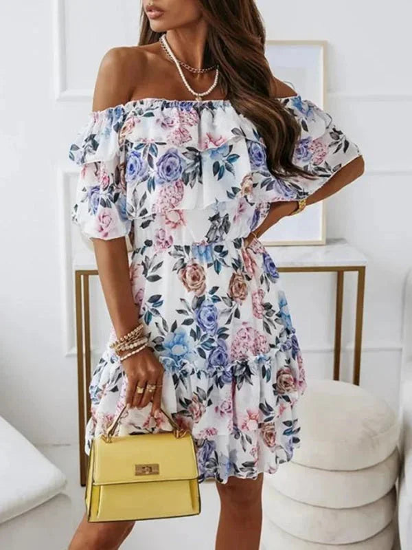Blue - Black floral chiffon mini dress featuring an off-the-shoulder ruffled neckline and a tiered skirt.