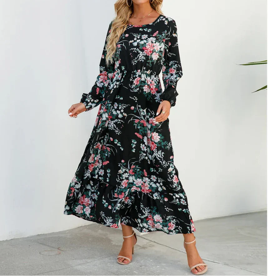 Black - Woman wearing a long sleeve floral midi dress with a cinched waist and tiered hem