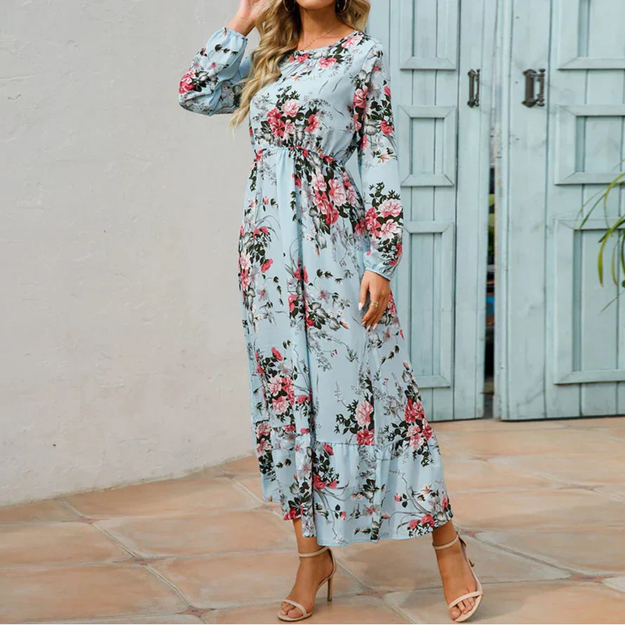 Violet (Almost sold out) - Woman wearing a long sleeve floral midi dress with a cinched waist and tiered hem