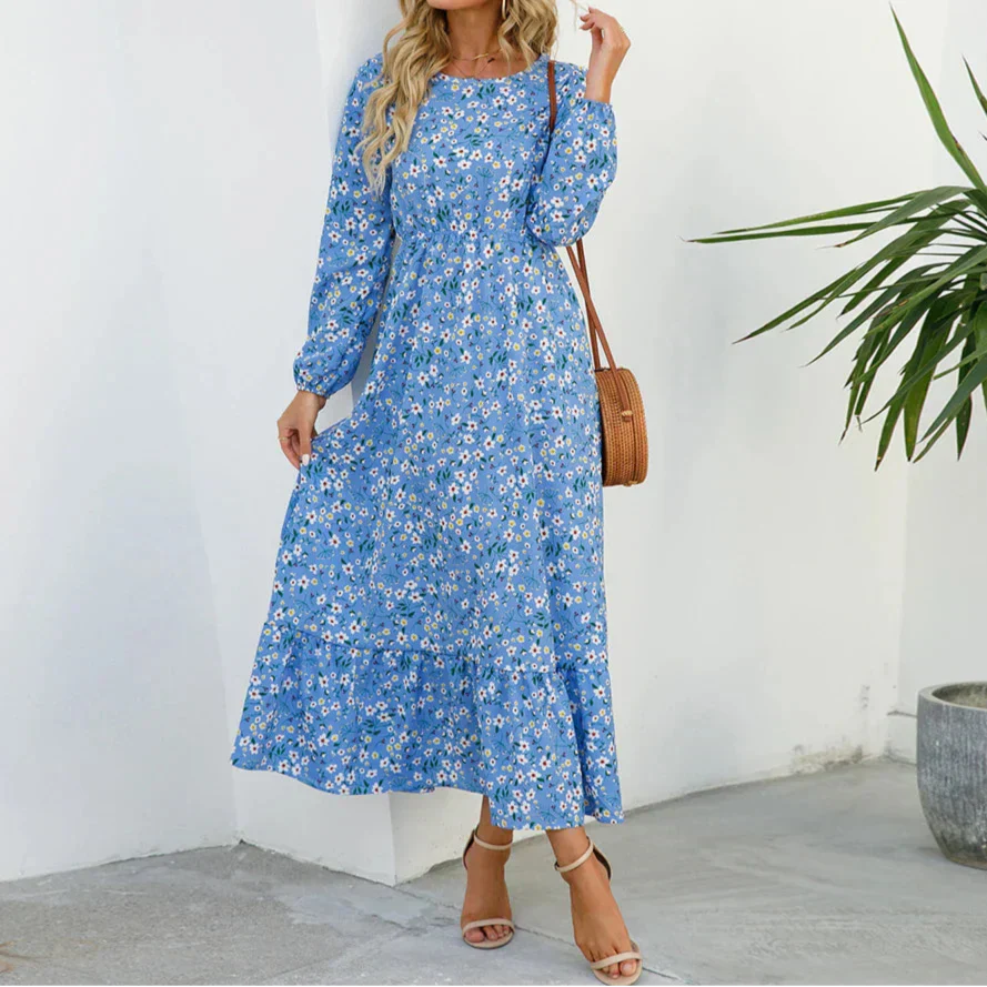 Blue - Woman wearing a long sleeve floral midi dress with a cinched waist and tiered hem