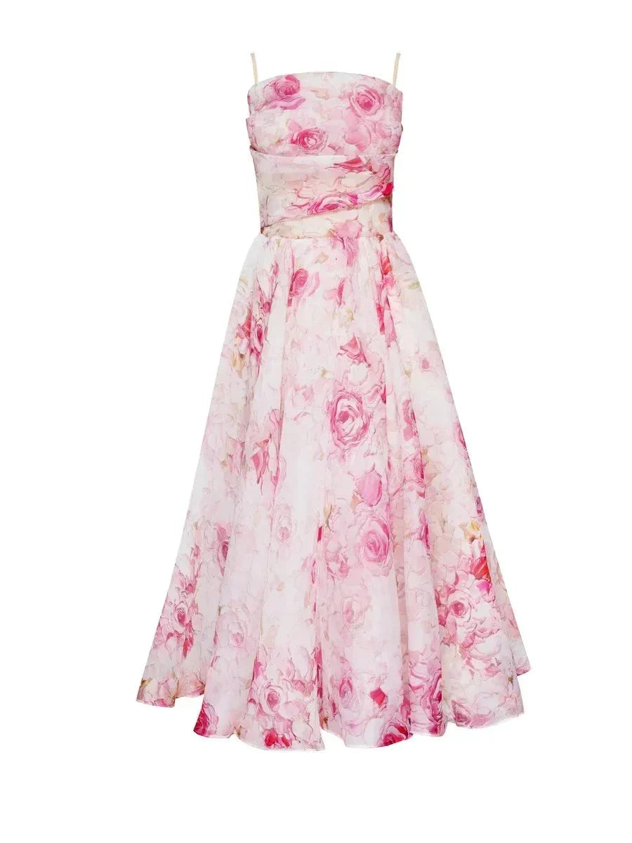 Purple - White midi dress with pink and green floral print, featuring a ruched bodice, spaghetti straps, and a full A-line skirt.