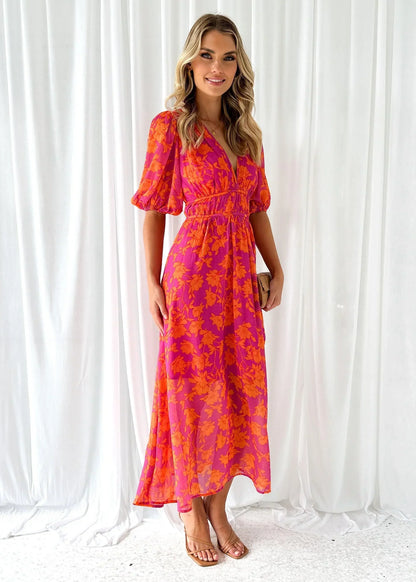 Bright pink and orange floral print midi dress featuring a deep V-neckline, short puff sleeves, and a wide smocked waistband.