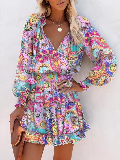 Light Purple - Woman wearing a dark mini dress with large bright floral print, featuring long sleeves, a smocked waist, and a tiered ruffle skirt