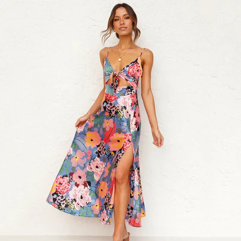 Pink - Green floral midi dress featuring a tie-front bodice, midriff cutout, and delicate spaghetti straps.