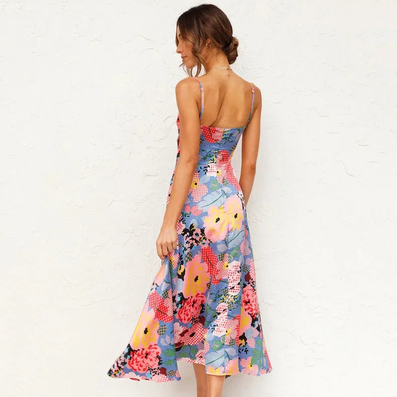 Pink - Green floral midi dress featuring a tie-front bodice, midriff cutout, and delicate spaghetti straps.