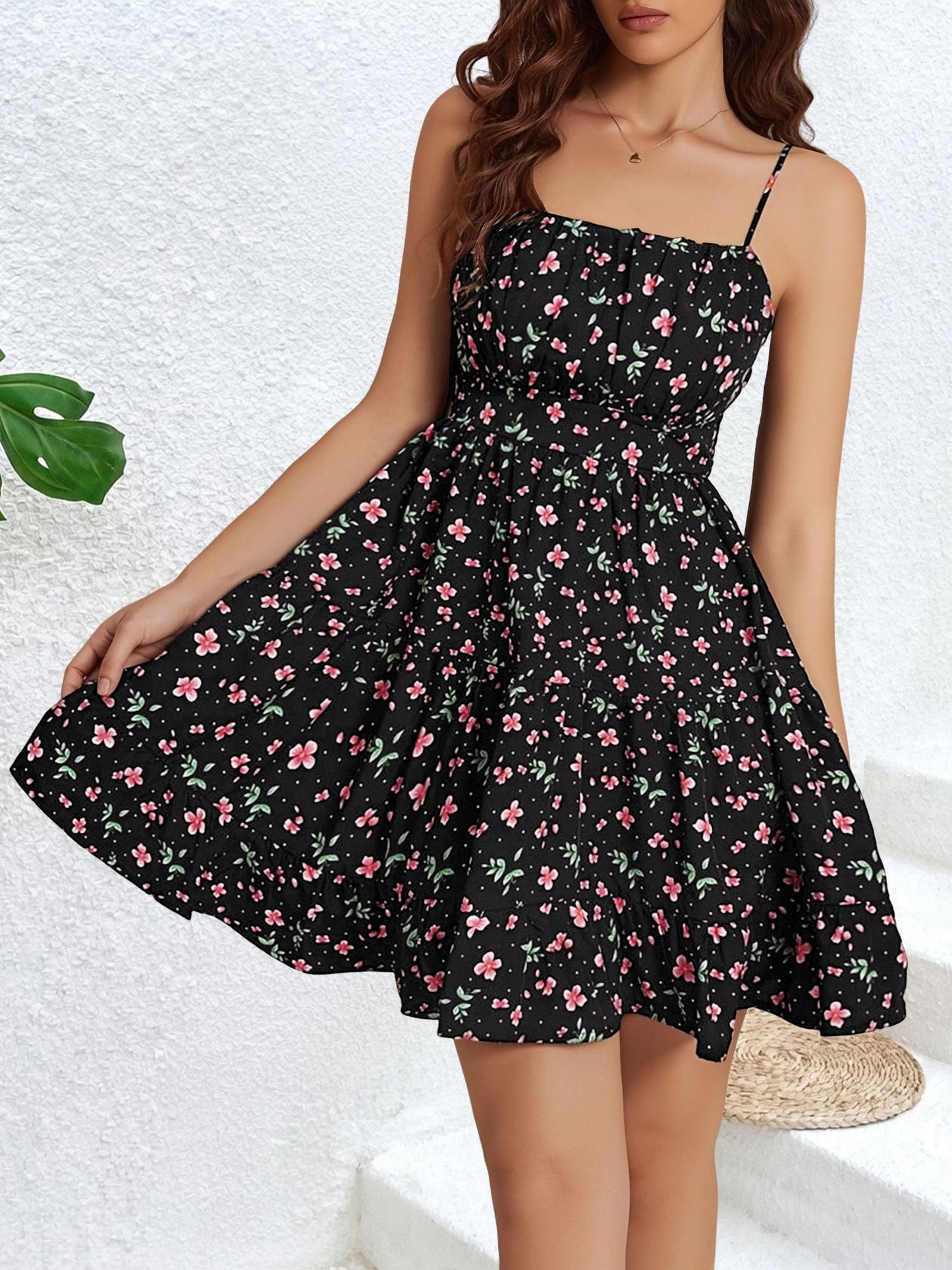 Black - Woman wearing a short floral spaghetti strap tiered sundress