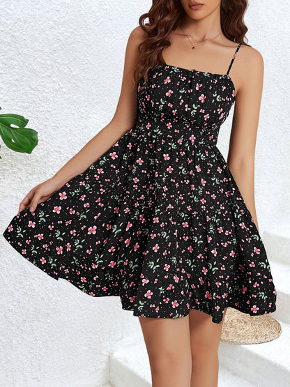 Black - Woman wearing a short floral spaghetti strap tiered sundress