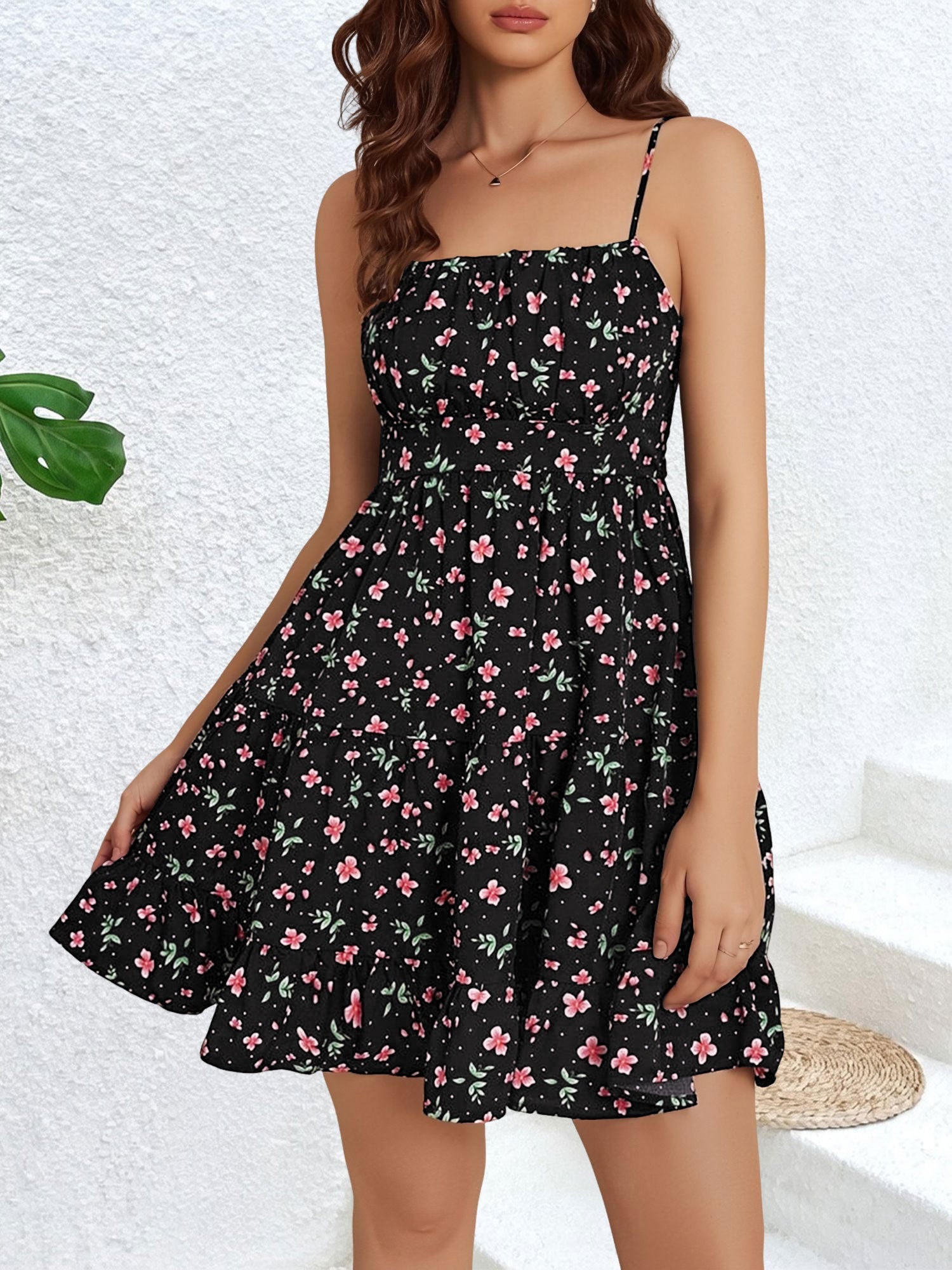 Black - Woman wearing a short floral spaghetti strap tiered sundress