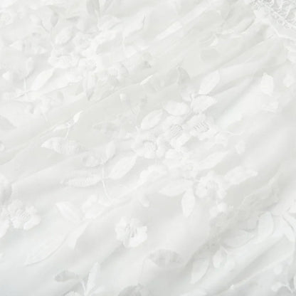 White - White floral appliqué tulle mini dress featuring a deep plunge neckline, crochet-trimmed waist, and a fluid A-line skirt.