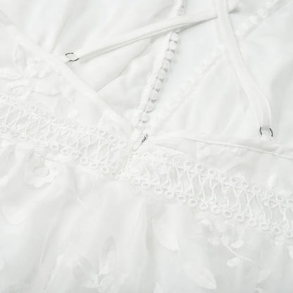 White - White floral appliqué tulle mini dress featuring a deep plunge neckline, crochet-trimmed waist, and a fluid A-line skirt.