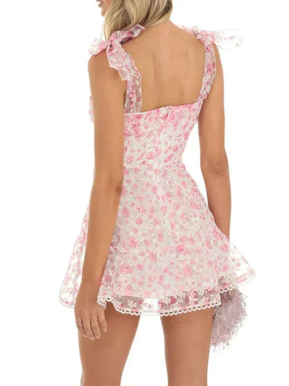 Pink - Pink and white floral tulle mini dress featuring a square neckline, tie-shoulder straps, and a scalloped hem.