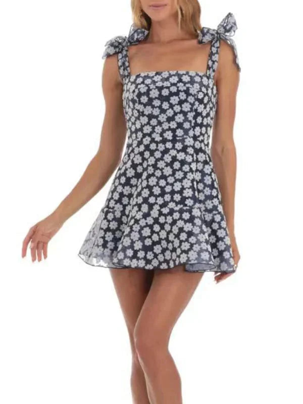 Blue - Pink and white floral tulle mini dress featuring a square neckline, tie-shoulder straps, and a scalloped hem.