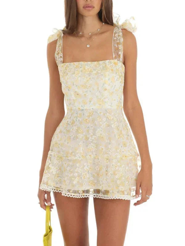 Light yellow - Pink and white floral tulle mini dress featuring a square neckline, tie-shoulder straps, and a scalloped hem.