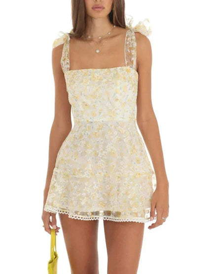 Light yellow - Pink and white floral tulle mini dress featuring a square neckline, tie-shoulder straps, and a scalloped hem.