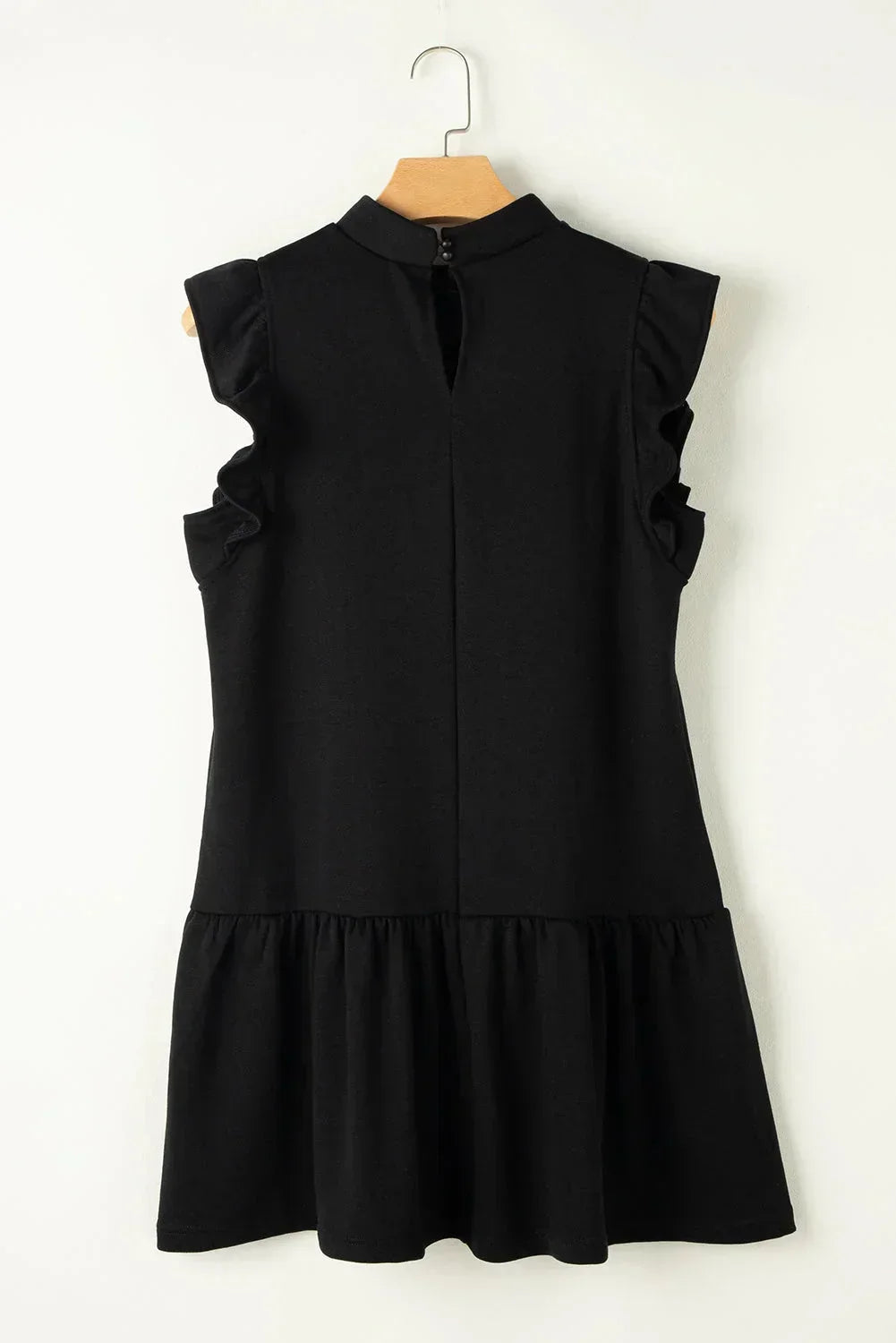 Black - Black textured mini dress featuring flutter sleeves, a high neckline, and a drop-waist ruffled hem.