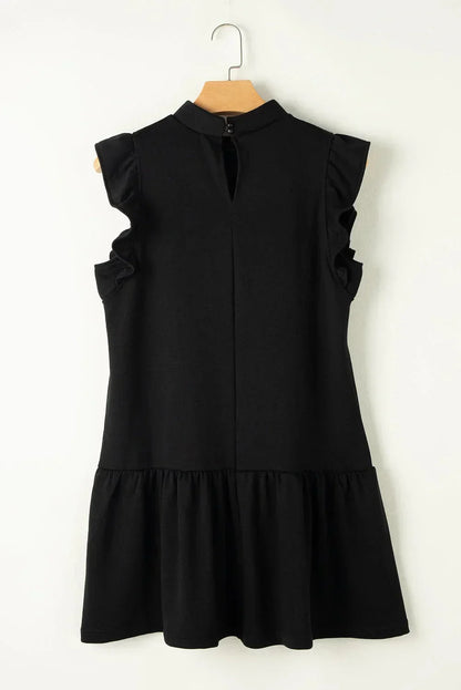 Black - Black textured mini dress featuring flutter sleeves, a high neckline, and a drop-waist ruffled hem.