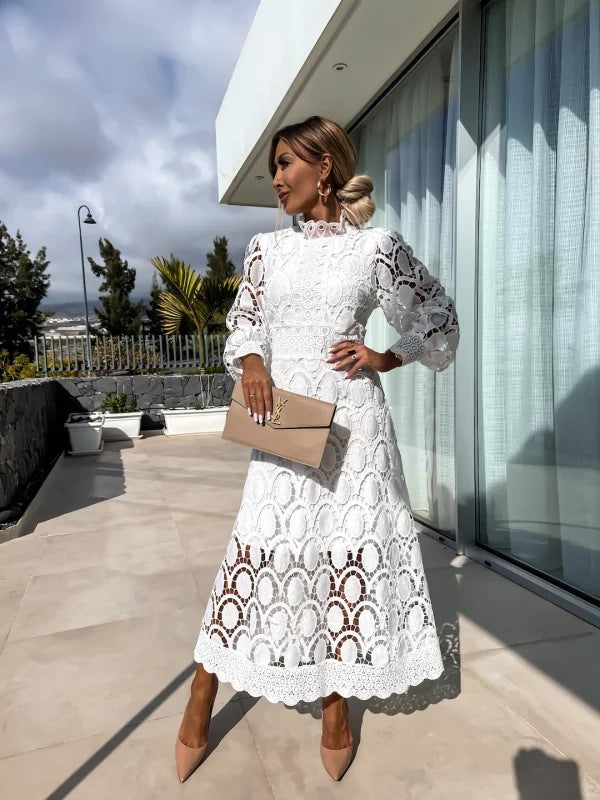 White - Light blush pink geometric crochet midi dress featuring a high scalloped mock neck, long balloon sleeves, banded waist, and partially lined A-line skirt.