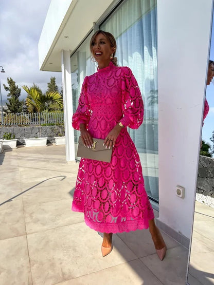 Pink - Light blush pink geometric crochet midi dress featuring a high scalloped mock neck, long balloon sleeves, banded waist, and partially lined A-line skirt.
