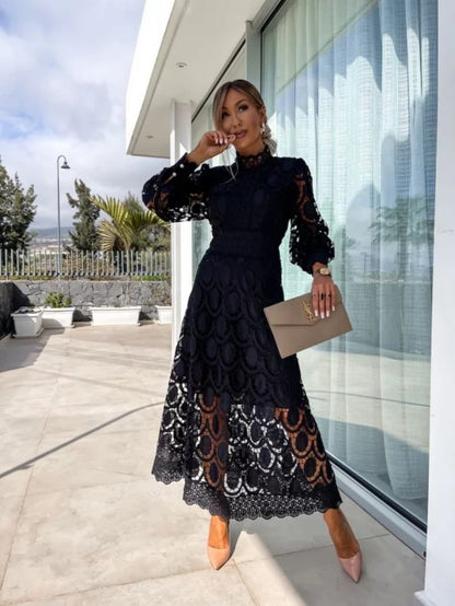 Black - Light blush pink geometric crochet midi dress featuring a high scalloped mock neck, long balloon sleeves, banded waist, and partially lined A-line skirt.