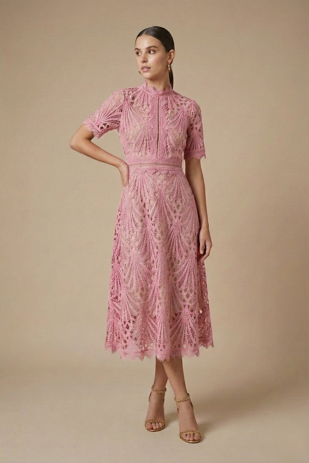 Pink - Black geometric guipure lace midi dress featuring a high scalloped neckline, short sleeves, a banded waist, and an A-line skirt over a nude lining.