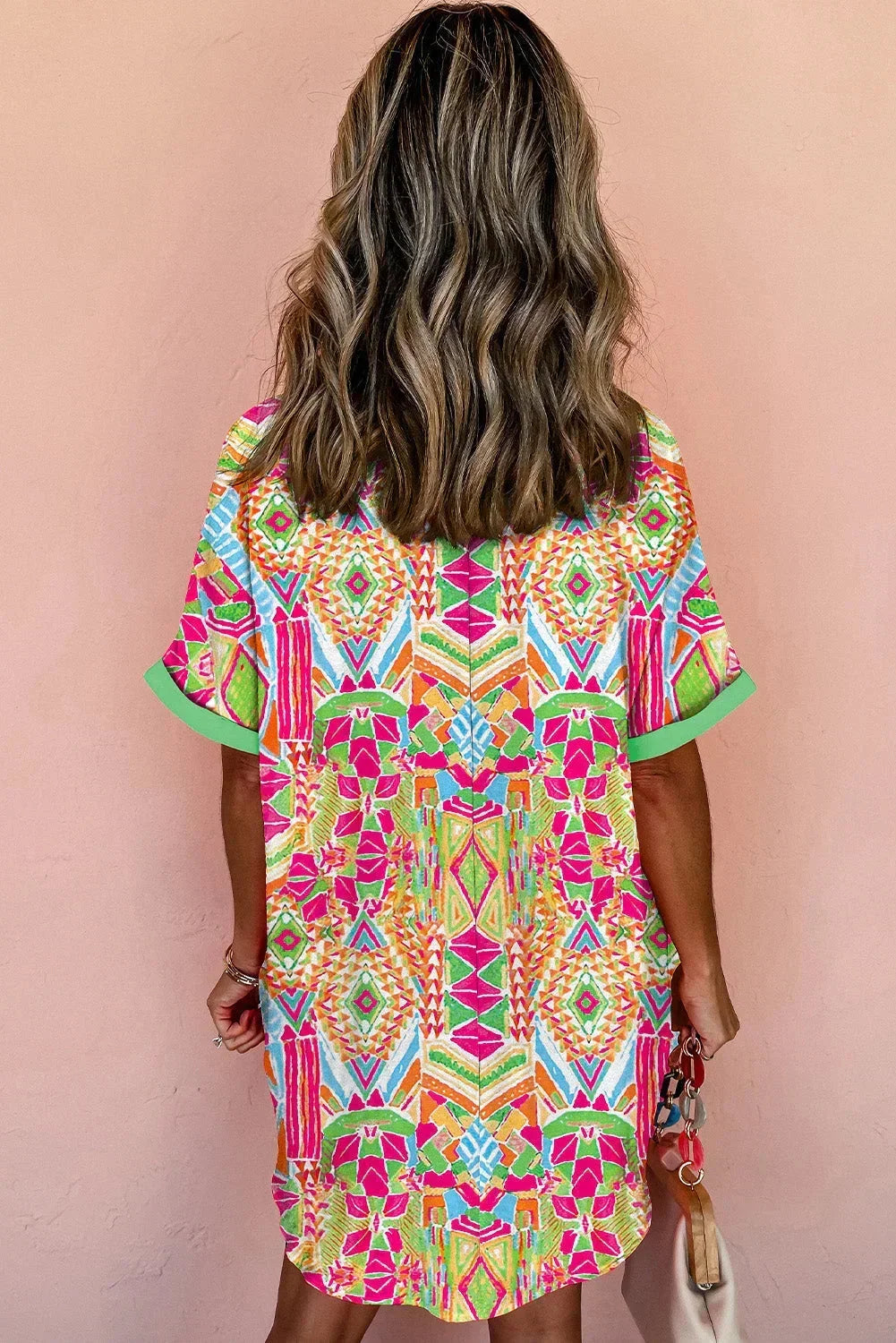 Rainbow - Women's vibrant geometric print mini shirt dress featuring a collared neckline, button-front placket with contrast green trim, and short sleeves.