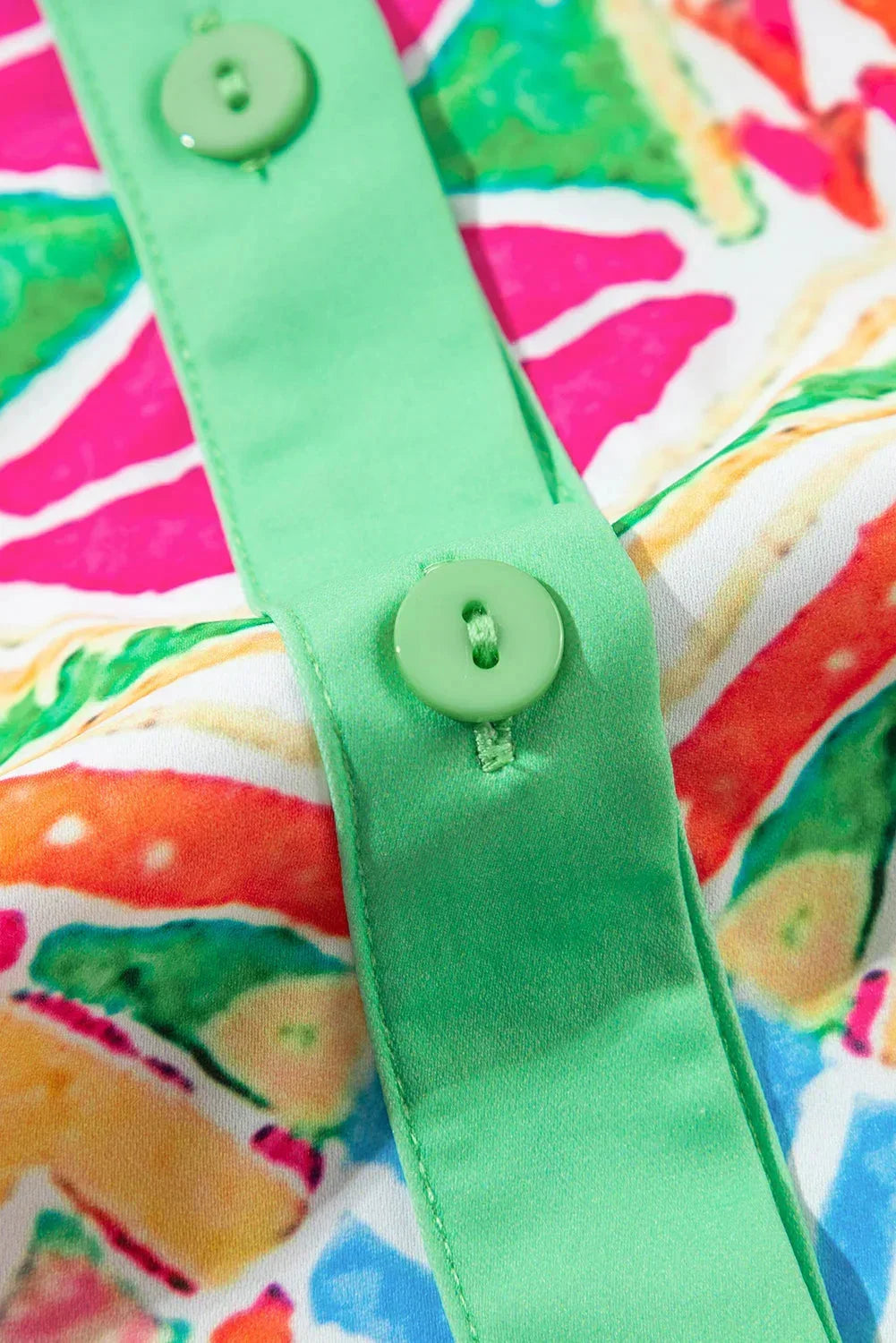 Rainbow - Women's vibrant geometric print mini shirt dress featuring a collared neckline, button-front placket with contrast green trim, and short sleeves.