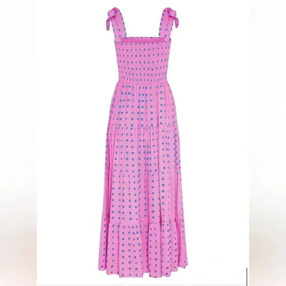 Pink - Pink and blue geometric patterned maxi dress featuring a smocked bodice, adjustable tie shoulder straps, and a flowing tiered skirt.