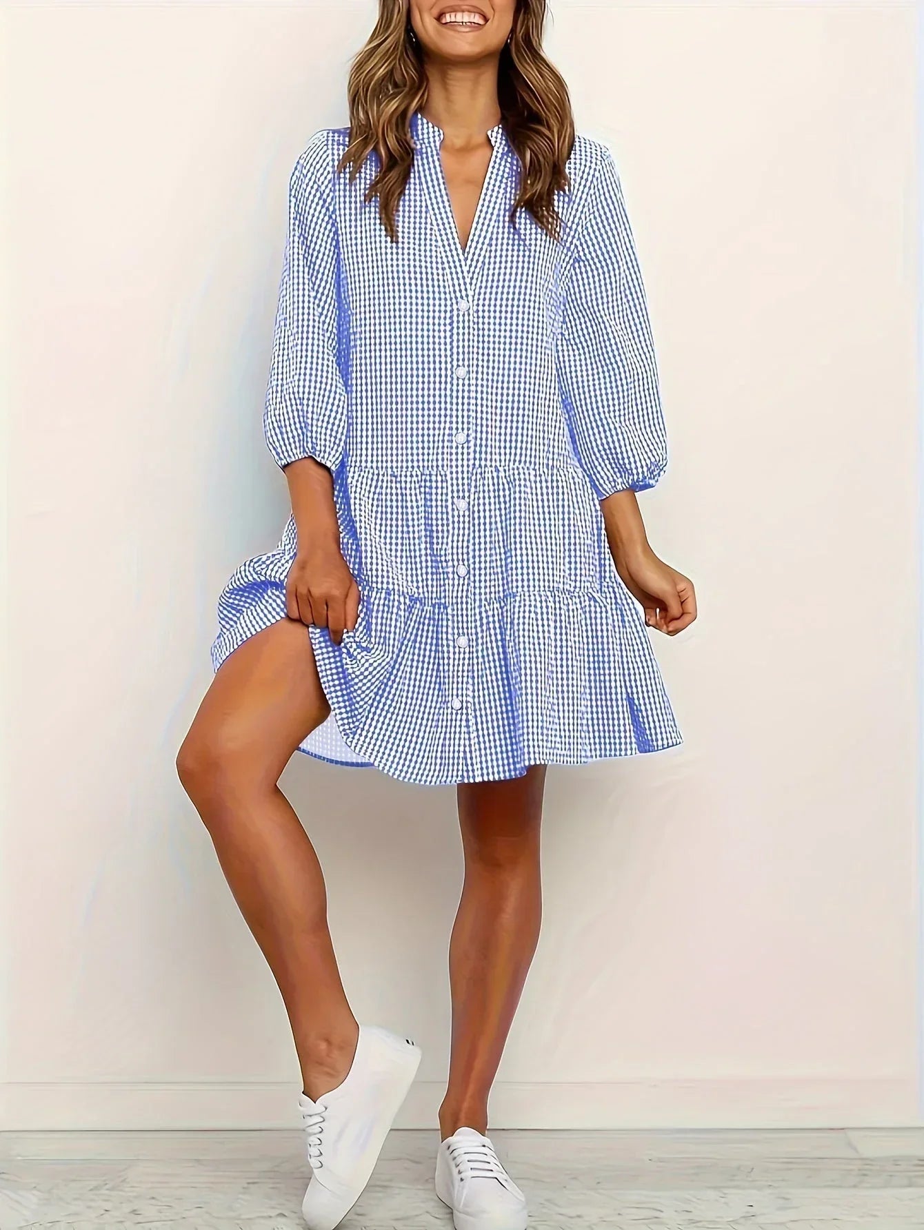 Blue - Pink and white gingham tiered mini dress featuring a collared v-neckline, button-front bodice, and three-quarter sleeves.