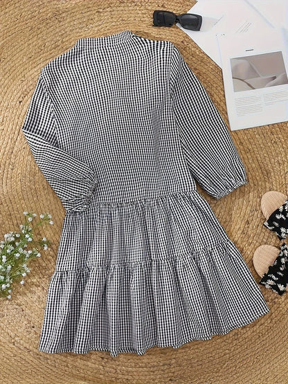 Blue - Pink and white gingham tiered mini dress featuring a collared v-neckline, button-front bodice, and three-quarter sleeves.