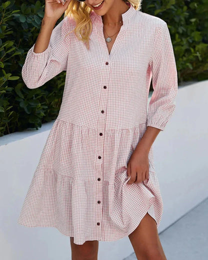 Pink - Light blue and white gingham mini dress featuring a split v-neckline, contrasting button-front closure, three-quarter sleeves, and a voluminous tiered skirt.