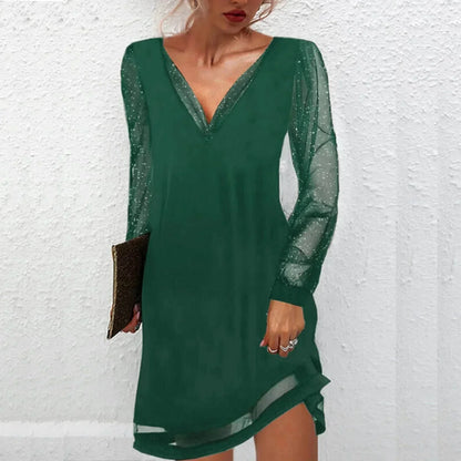 Green - Black mini dress featuring a solid V-neck bodice, long sheer tulle sleeves with metallic glitter flecks, and a sheer panel at the hem.