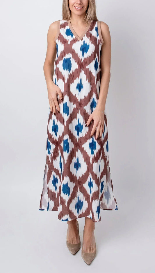 Tropical - Sleeveless midi dress featuring a brown and blue geometric ikat print, contrasting ribbed V-neckline, and side hem slits.